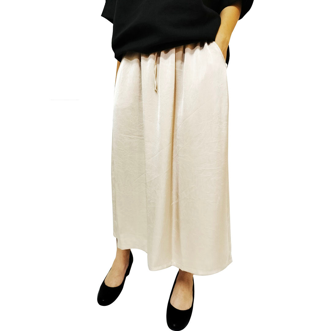 A summer loose-fit, slimming long skirt with a sophisticated, stylish, and elegant vibe, perfect for casual wear, featuring a side slit.
